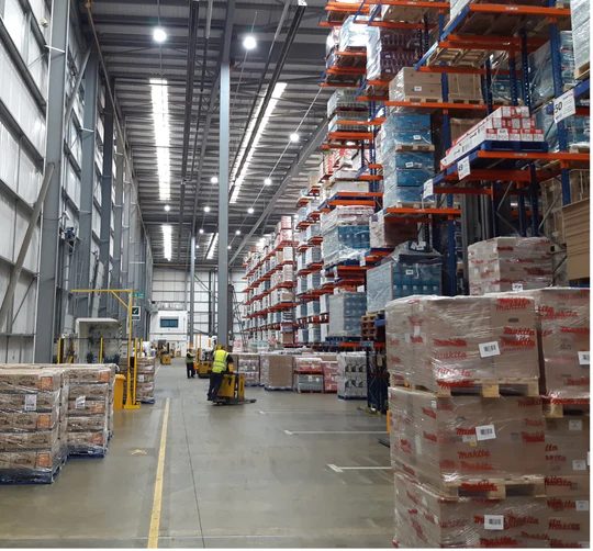 LED high bays over racking aisles at Bibby Distribution