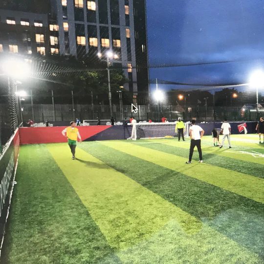 LED floodlights on the Wembley Football Club pitch at night